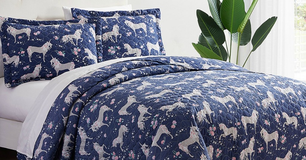Navy Blue Quilt with Unicorn print on queen size bed