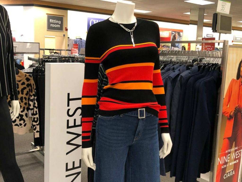 mannequin wearing sweater in store display