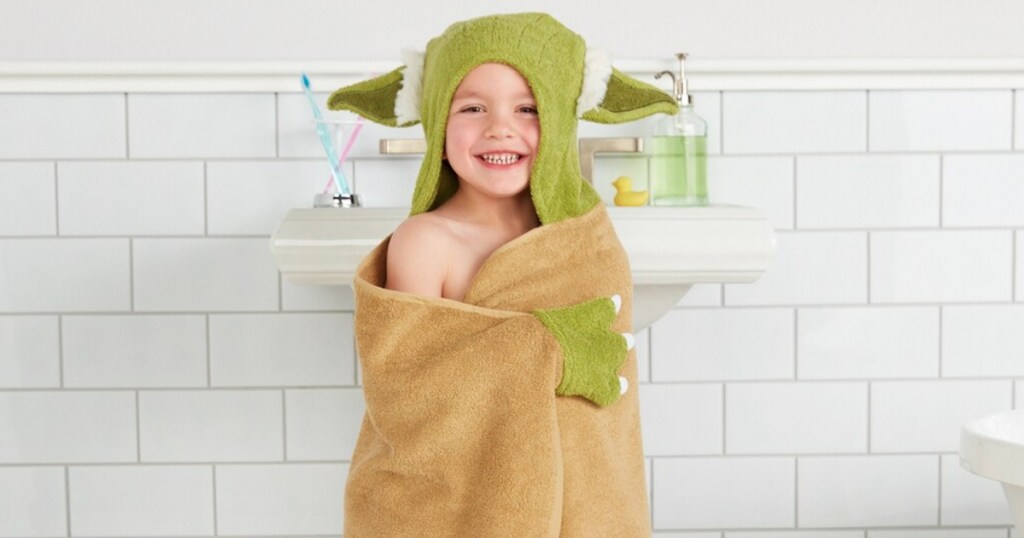 kid wearing hooded towel in bathroom