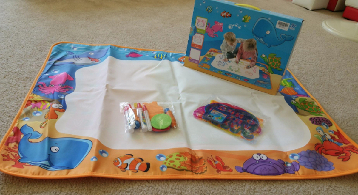 aquadoodle mat on floor with accessories and box