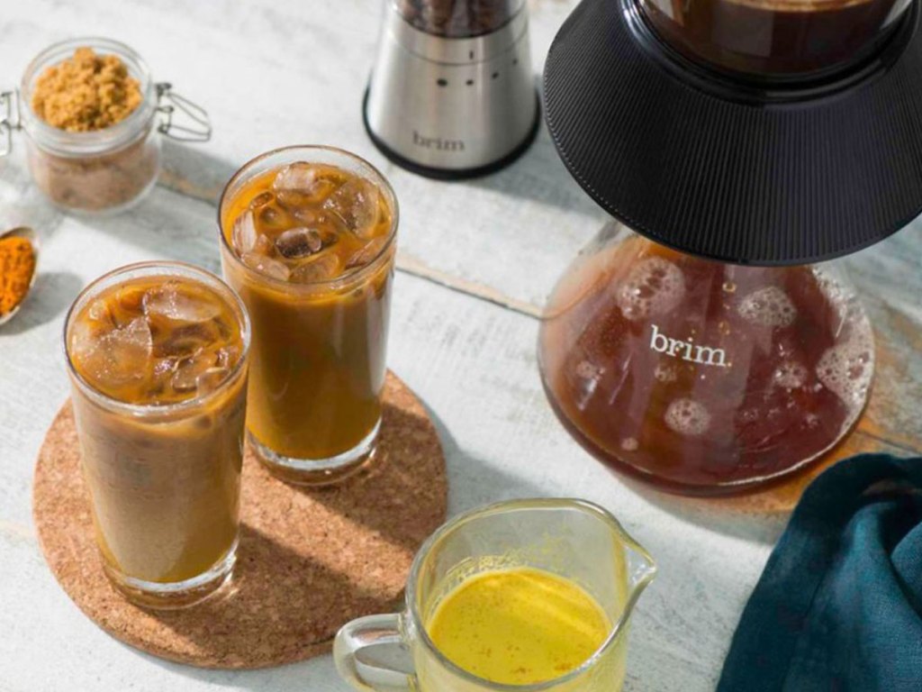 view of brim cold brew coffee maker with two cups of cold coffee