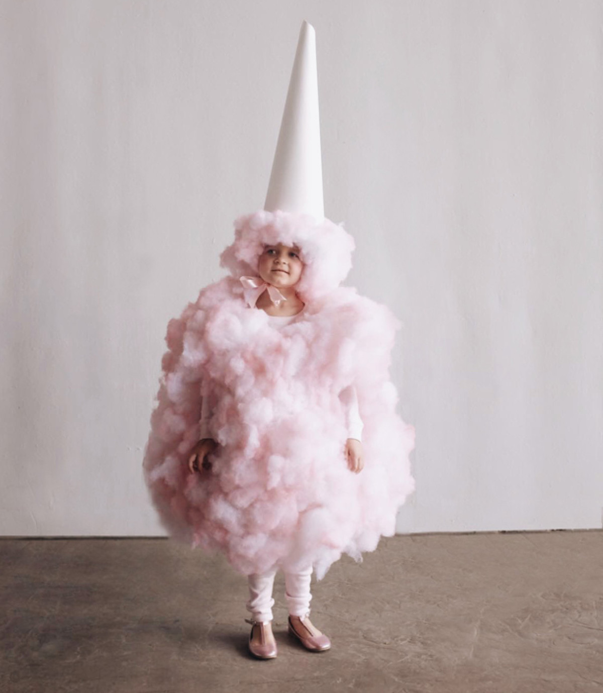 kid wearing pink cotton candy costume which is one of the best cheap costume ideas for adults or kids