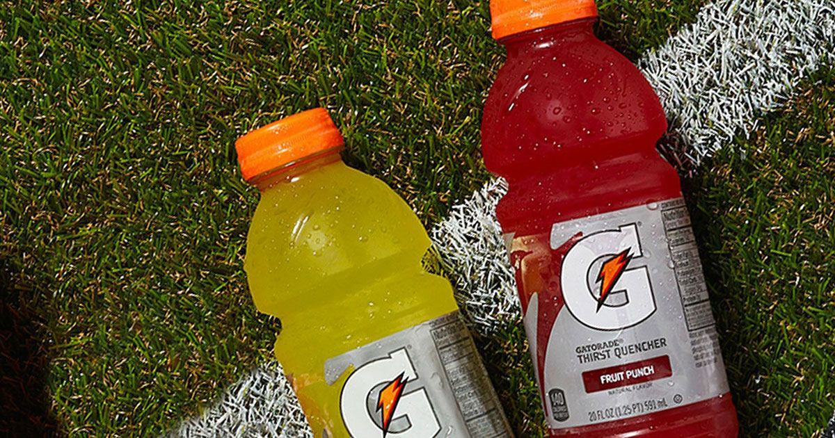 fruit punch and lemon lime gatorade bottles on football field