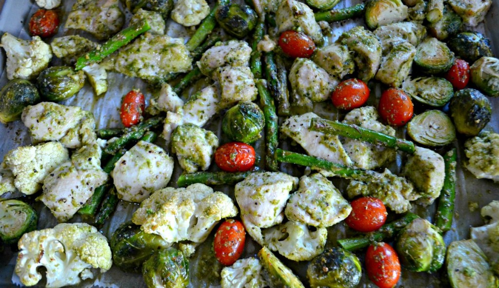 sheet pan with roasted pesto chicken and veggies