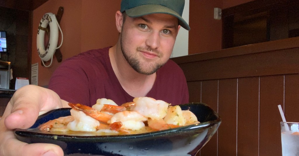 Stetson holding a bowl of shrimp