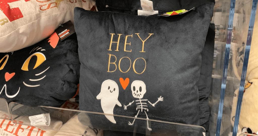 hey boo pillow with ghost and skeleton on it