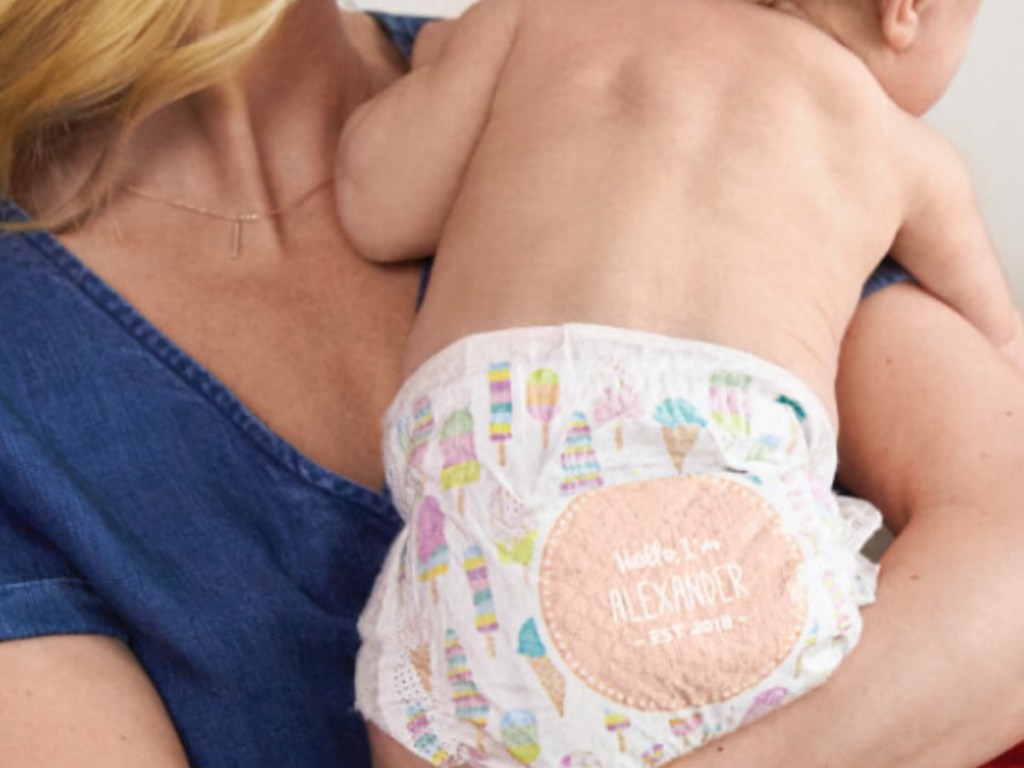 woman holding baby in personalized diaper