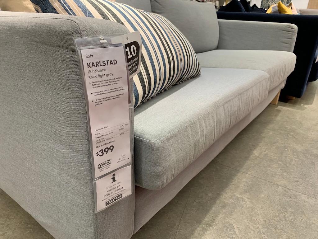 KARLSTAD couch at IKEA with striped throw pillow