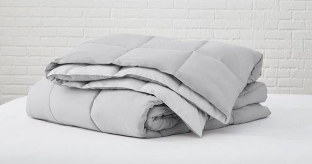 The Home Depot Reversible Comforter folded on mattress
