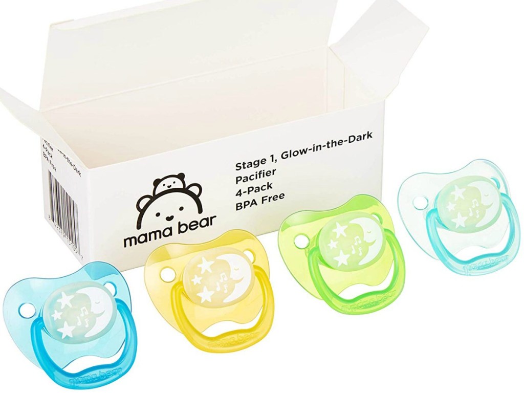 four colored pacifiers by white box