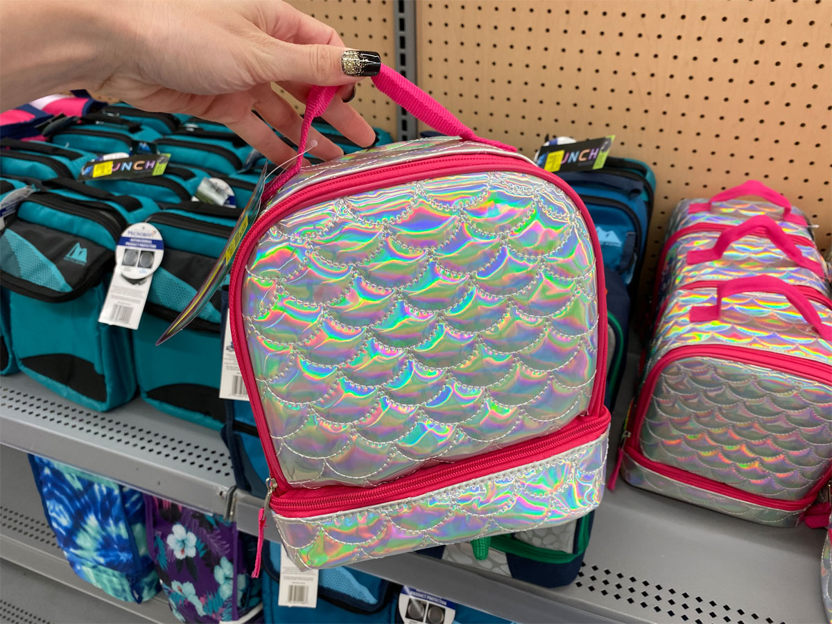 quilted silver scales lunch bag being held near clearance shelf at walmart