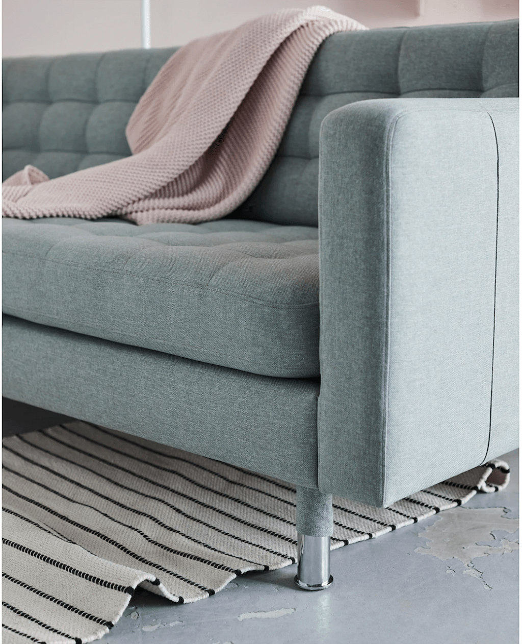 IKEA modern green sofa with blanket 