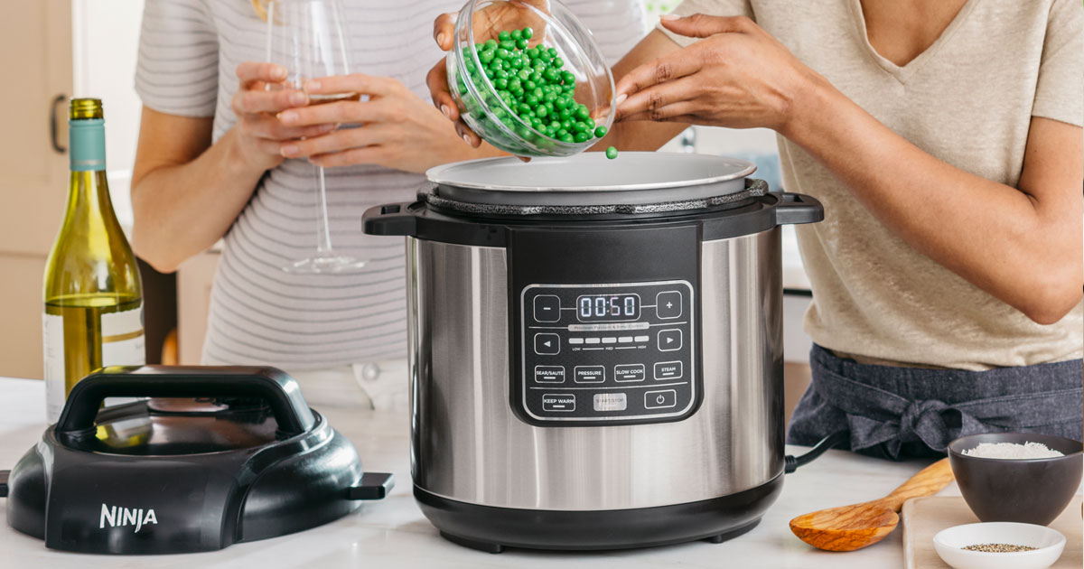 two women cooking in the kitchen with Ninja Instant Cooker