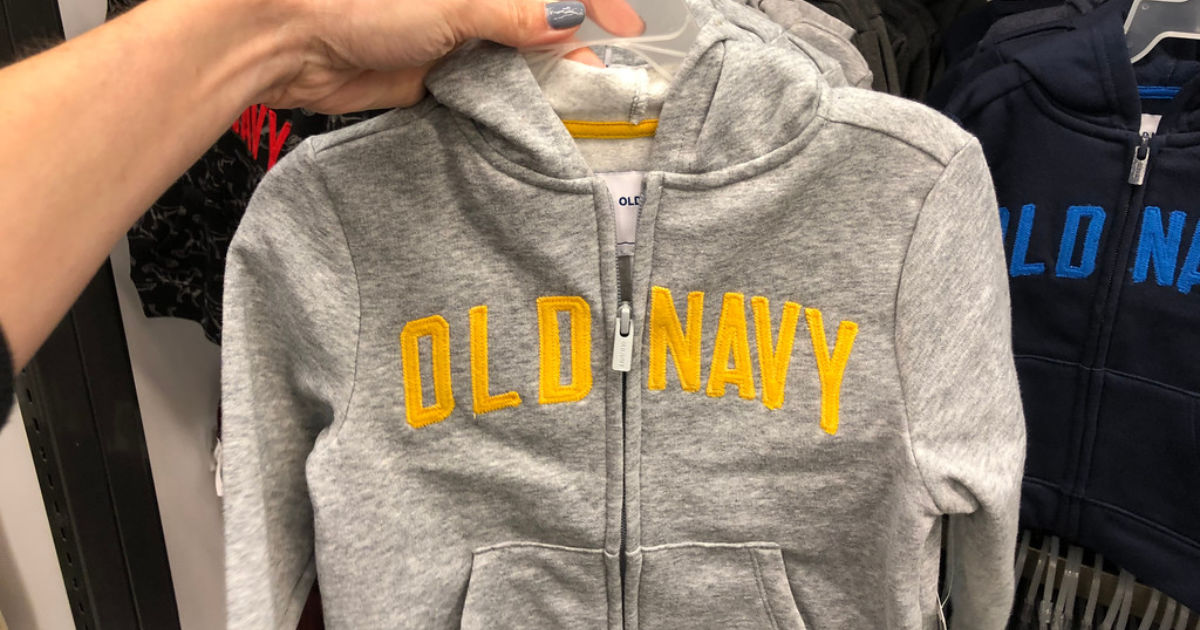 woman's hand holding old navy grey boys zip up hoodie