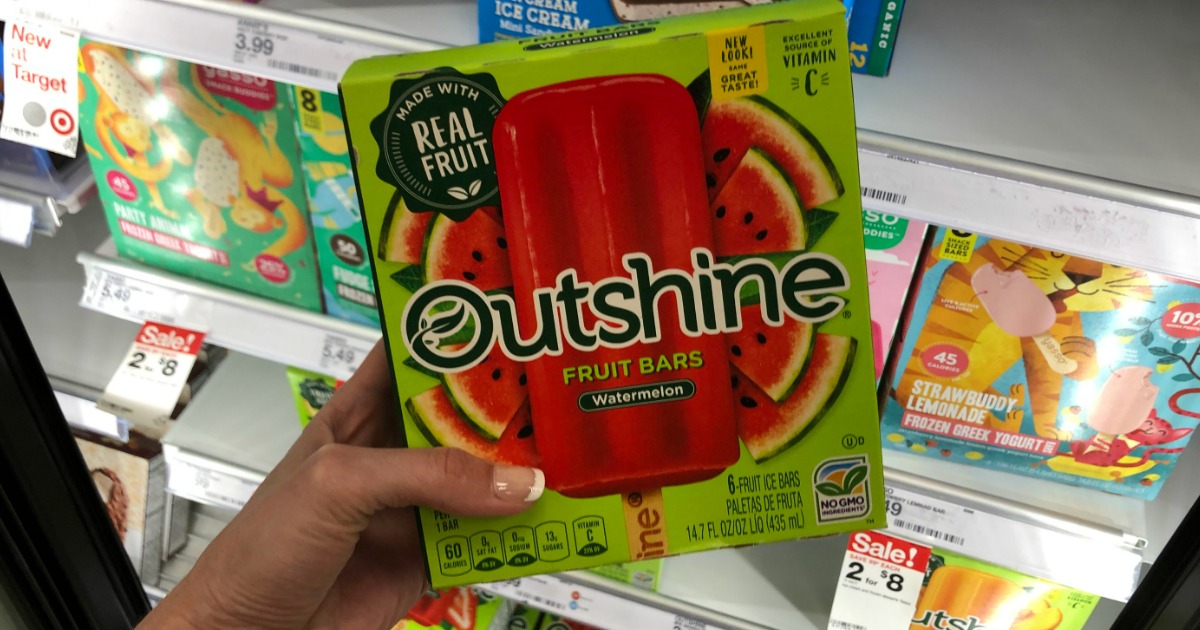 hand holding up outshine fruit bars in store