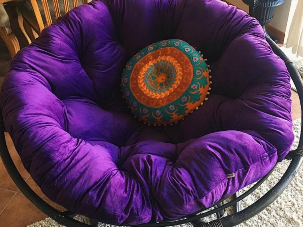 chair with purple pillow cushion