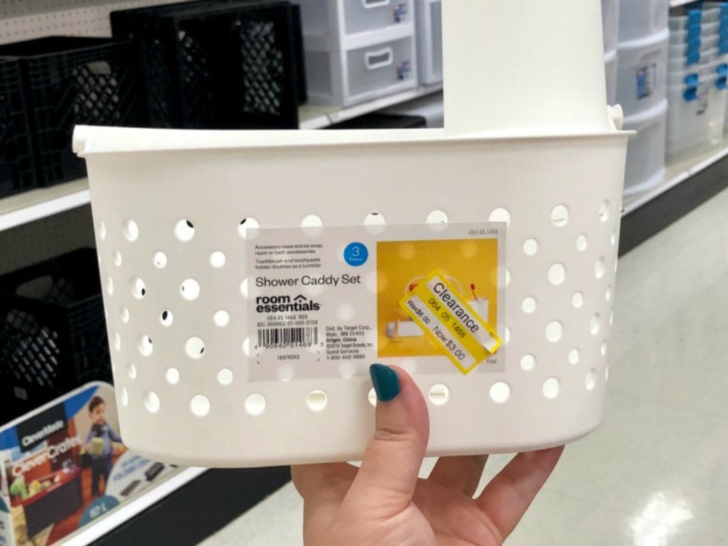 hand holding white basket by store display