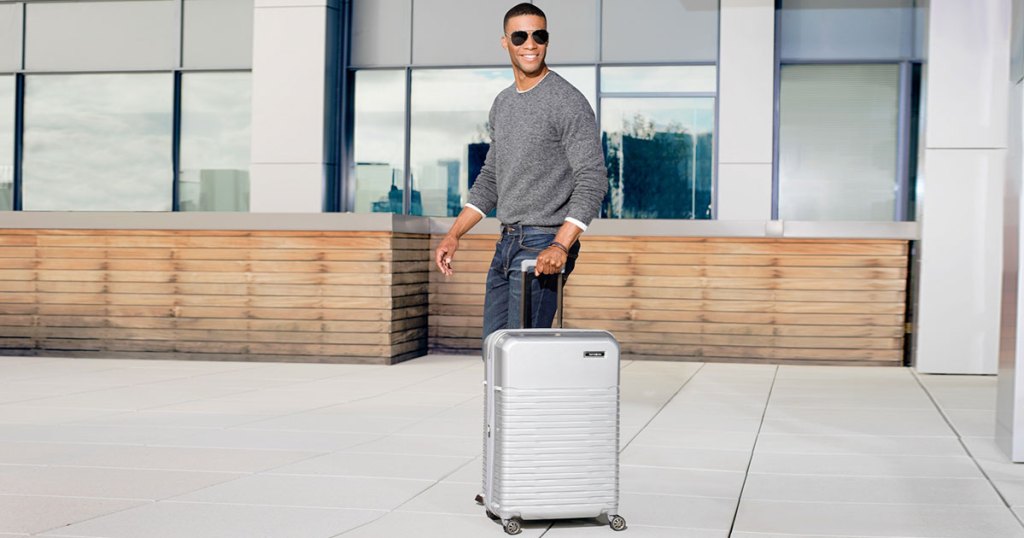 samsonite spettro spinner luggage man walking 