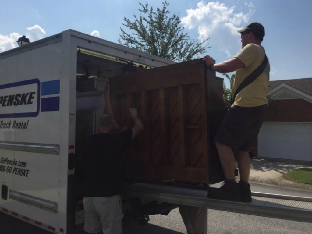 man on moving truck moving furniture