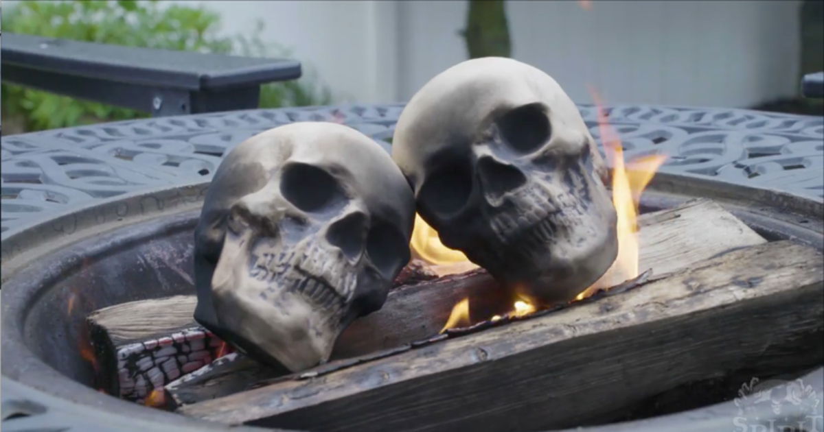 skull logs in fire