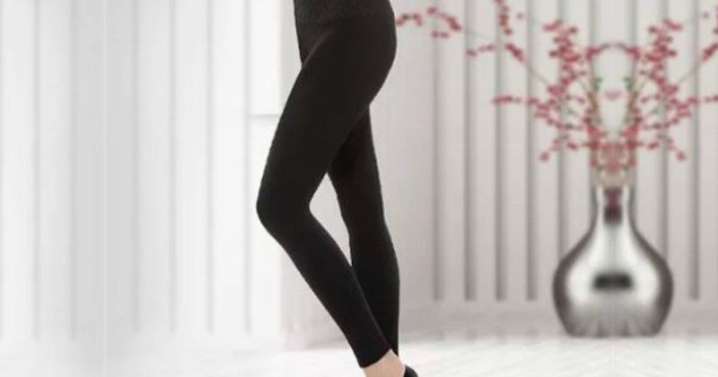 woman wearing black spanx leggings