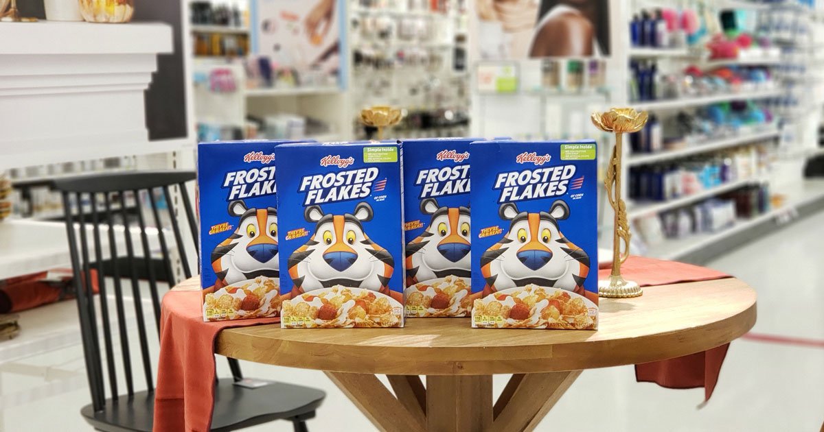 four boxes of Kellogg's Frosted Flakes on a store table