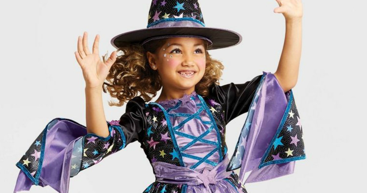 little girl in witch costume