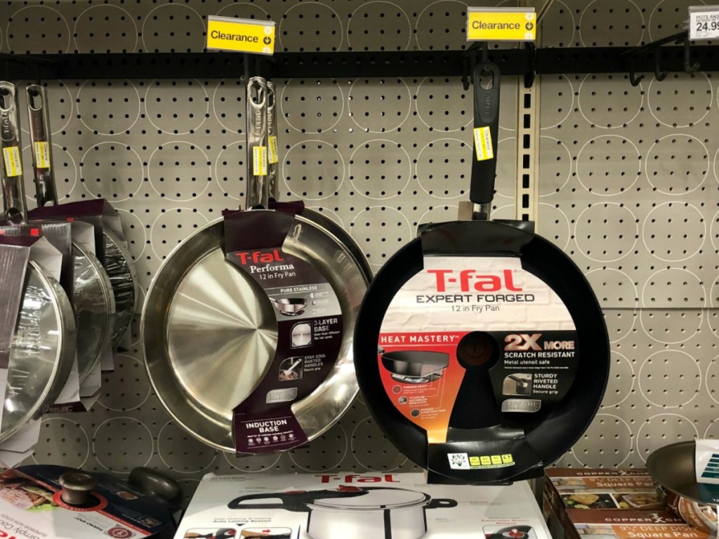 store shelf with pans hanging up