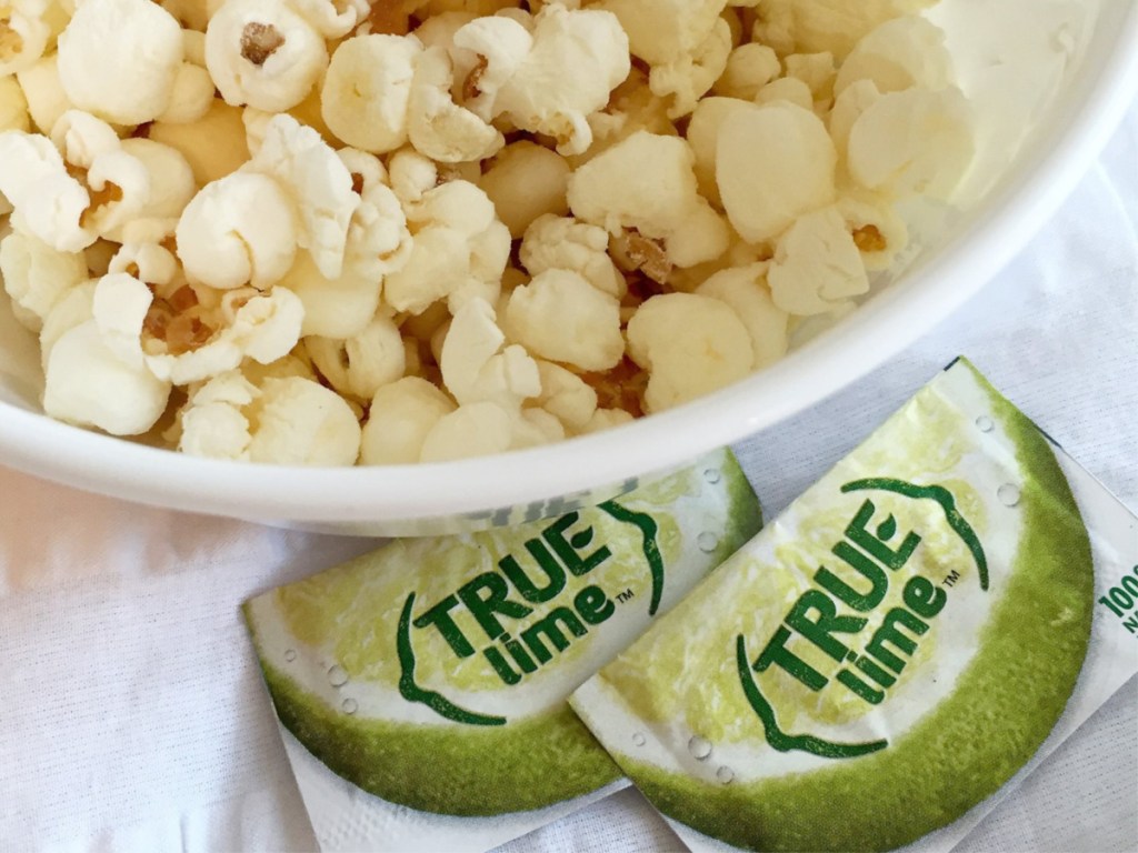 true lime packets sitting next to popcorn bowl