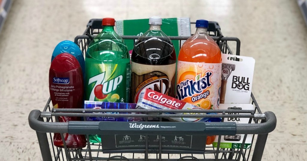 softsoap body wash, 7up, a&w, diet sunkist 2 liter soda, colgate and crest toothpaste and bulldog razors in a cart at walgreens