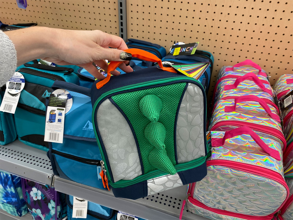 hand holding dinosaur lunch tote on clearance at walmart