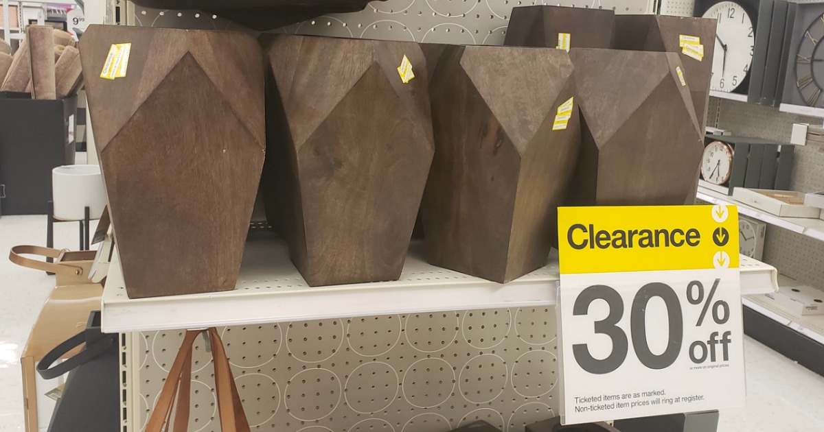 wooden vases on store shelf with 30% off clearance sign