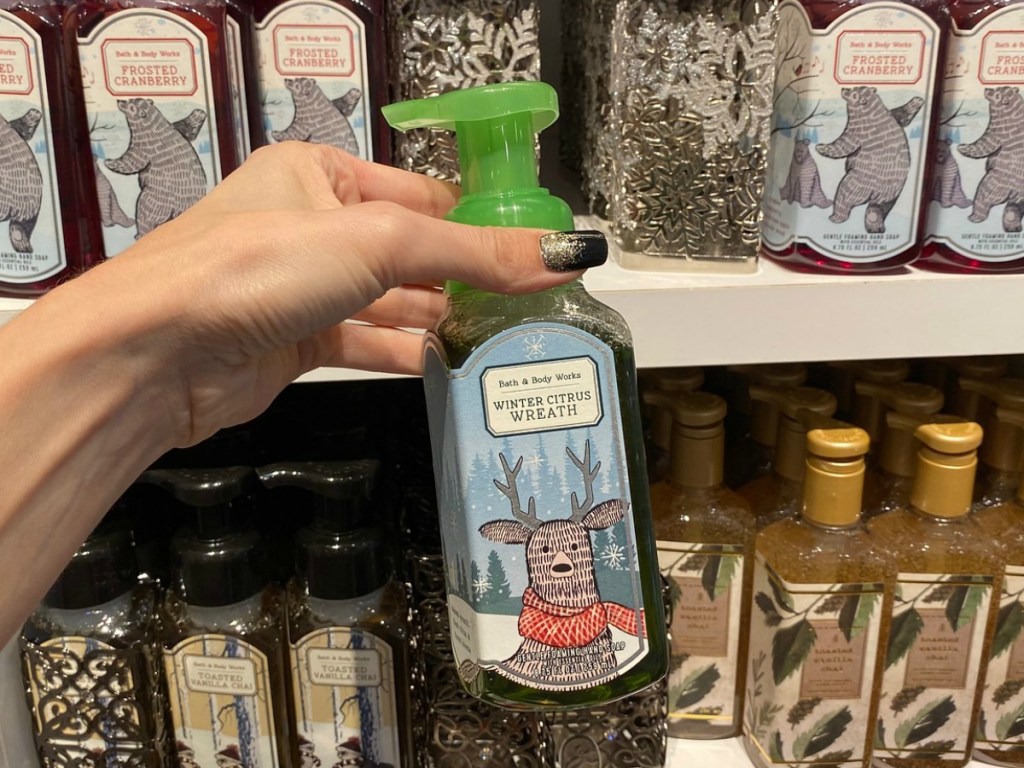 Bath & Body Works Winter Scent hand soap in-store in hand in front of display