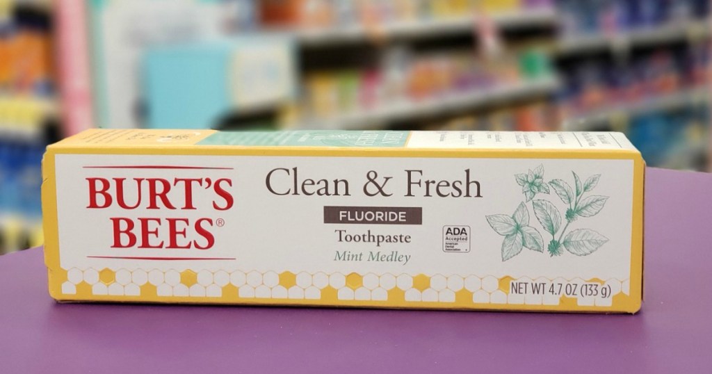 Burt's Bees clean & fresh toothpaste box on purple surface