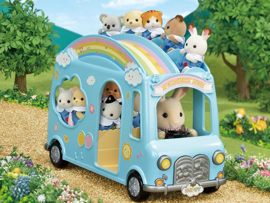 Calico Critters Sunshine Nursery Bus with figures inside on road scene