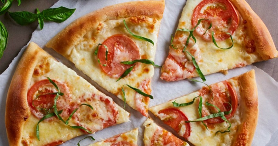 california pizza kitchen margarita pizza cut into slices on paper