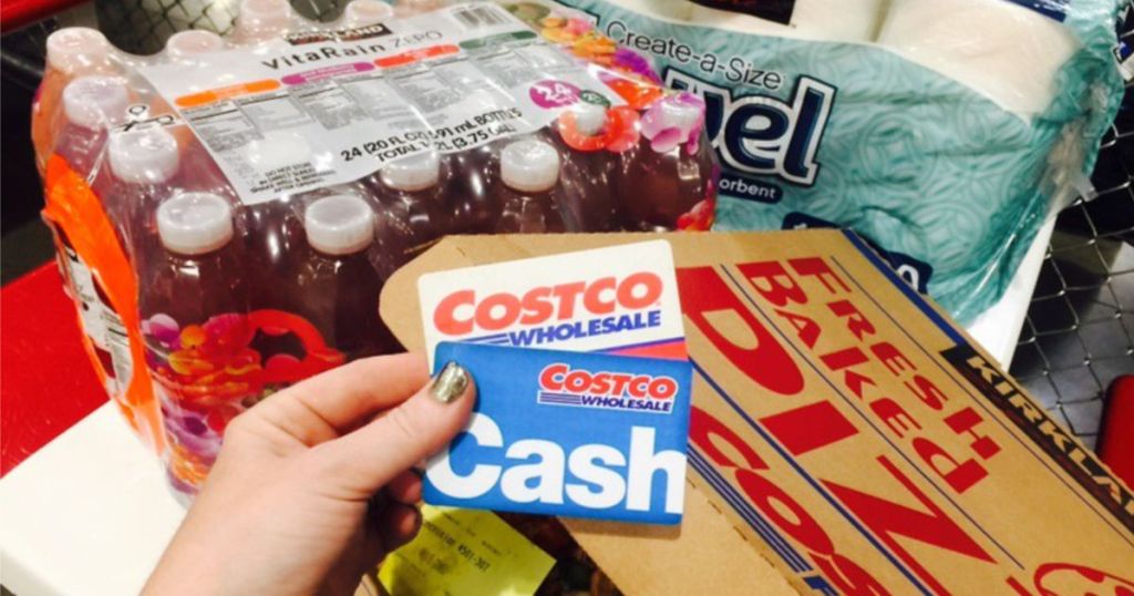 Costco Membership Card and Cash Card in front of Costco Shopping Cart
