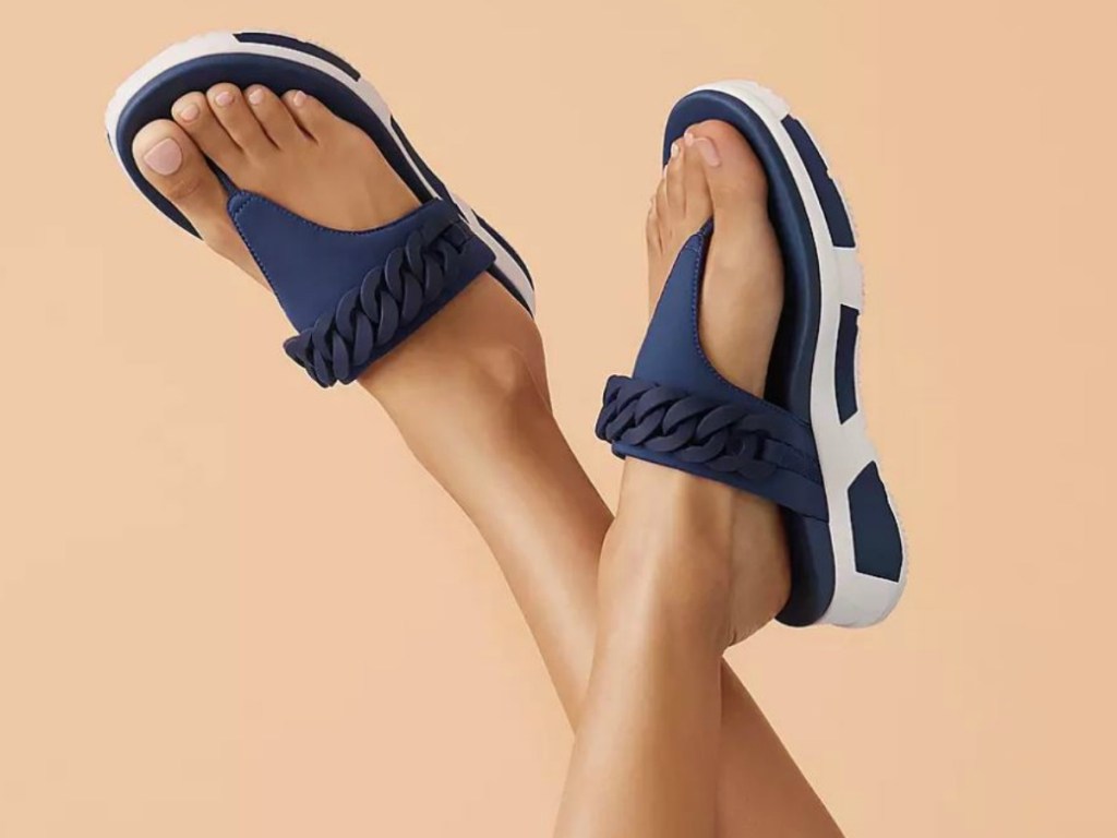 feet wearing blue sandals