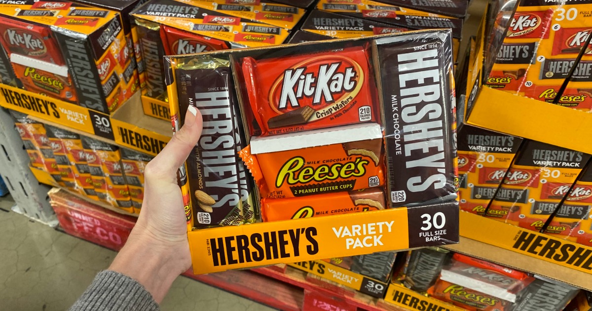 Woman holding Hershey's Variety Pack in Sam's Club