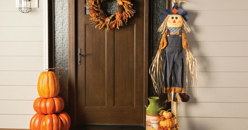 Holiday Living Boy Scarecrow at front door with Halloween decor