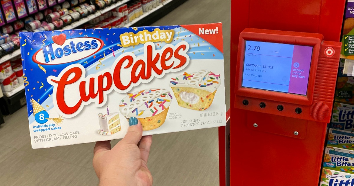 Hostess Birthday Cupcakes held in hand in front of Target price check