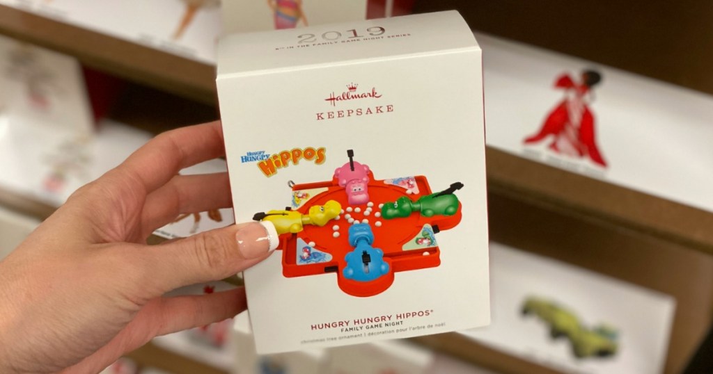 Woman holding Hallmark Hungry Hungry Hippos Ornament