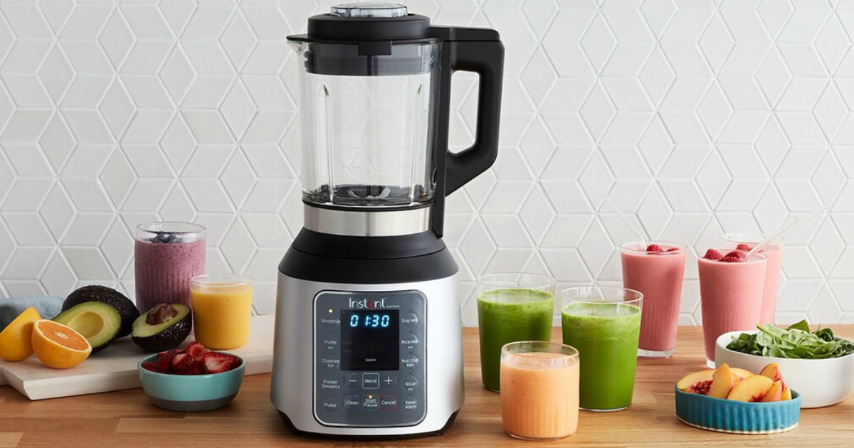 Instant Pot Nova Blender on table with fruit and smoothies