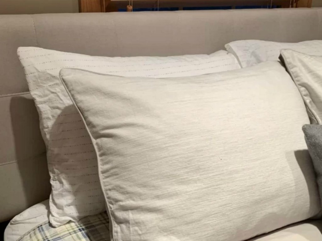 pillows resting against headboard