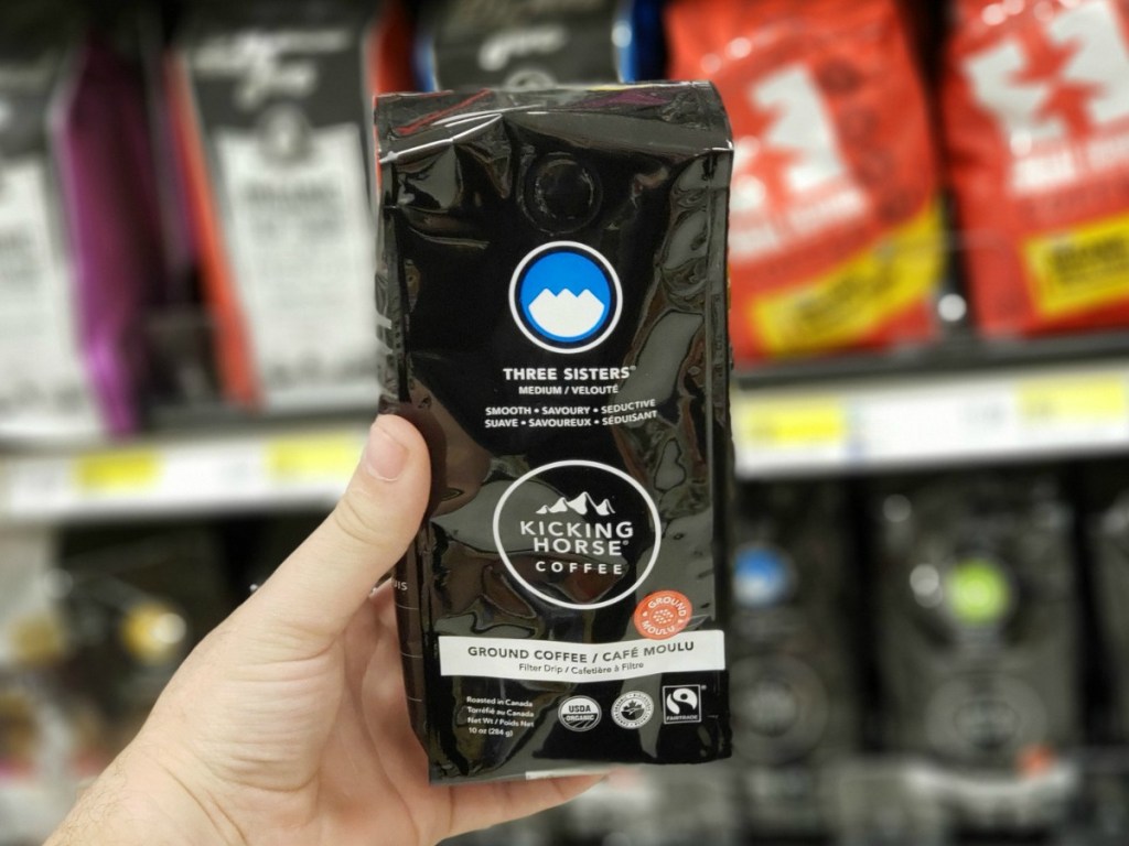 Kicking Horse Coffee Three Sisters coffee in bag, in hand, in-store