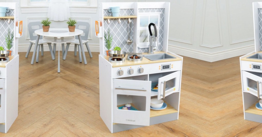 KidKraft Let's Cook Wooden Play Kitchen in playroom