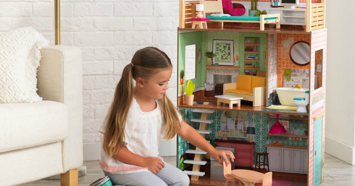 girl playing with kidkraft vintage dottie dollhouse