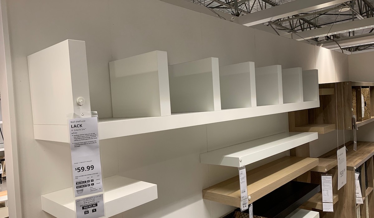 white shelf with cubbies hanging on wall