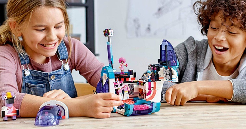 kids playing with LEGO Movie Party Bus set