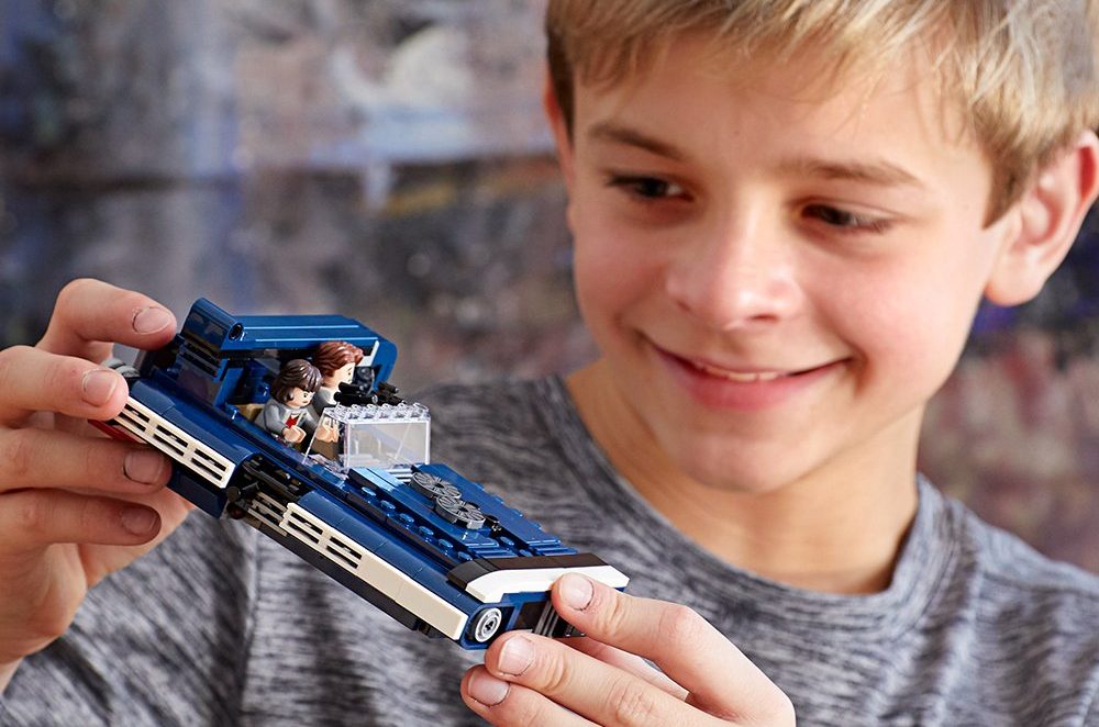 boy playing with LEGO Star Wars Han Solo Landspeeder